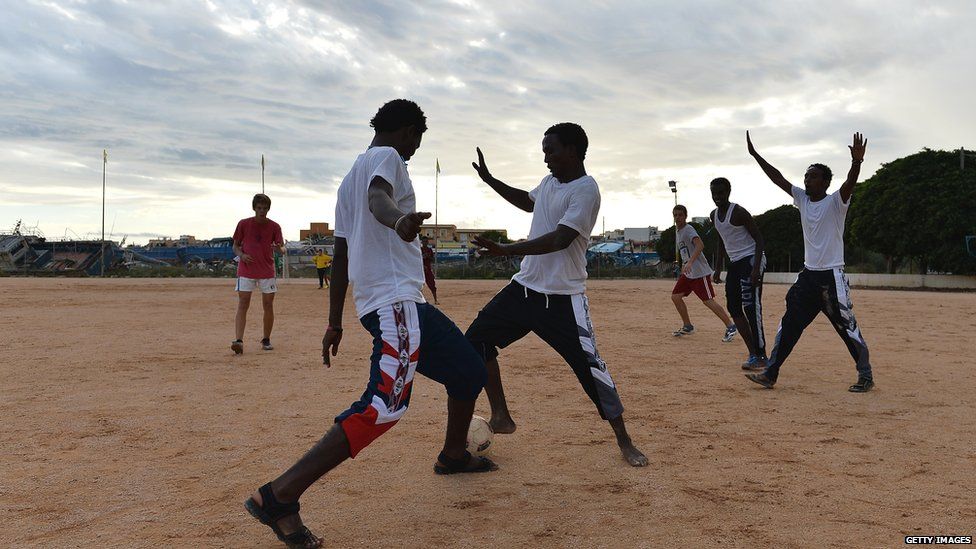 Eritreans playing football at Lampedusa Football Field, Lampedusa, Italy - Sunday 6 October 2013