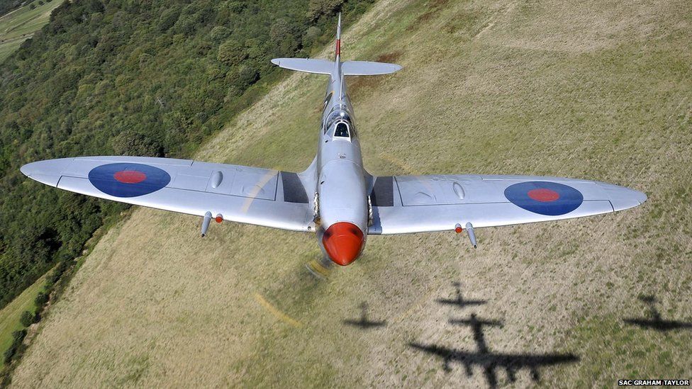 Spitfire flying over fields