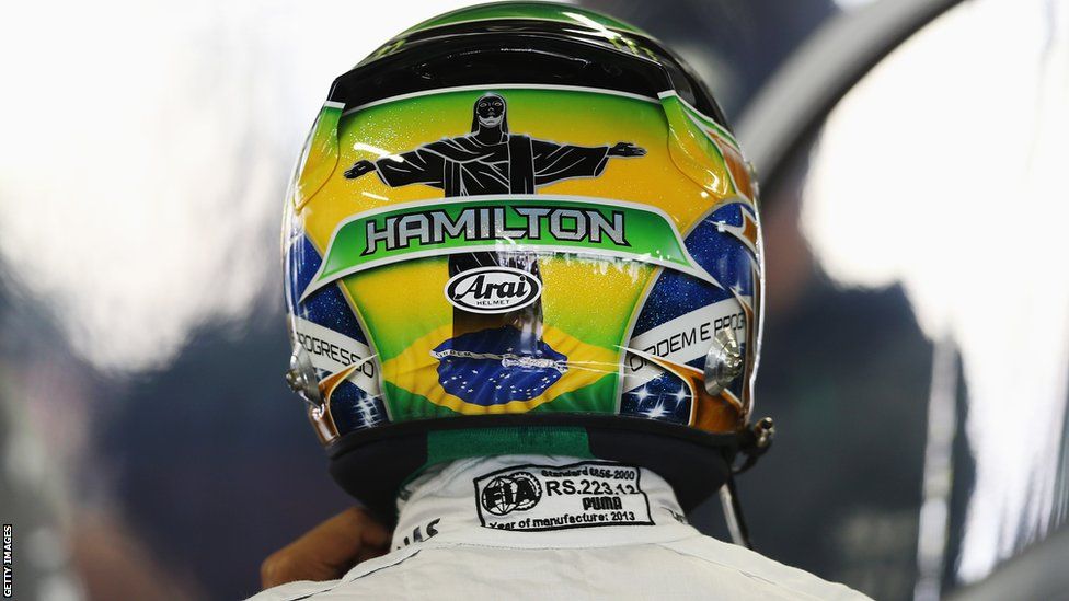 Lewis Hamilton carries an image of the Christ the Redeemer monument on his helmet