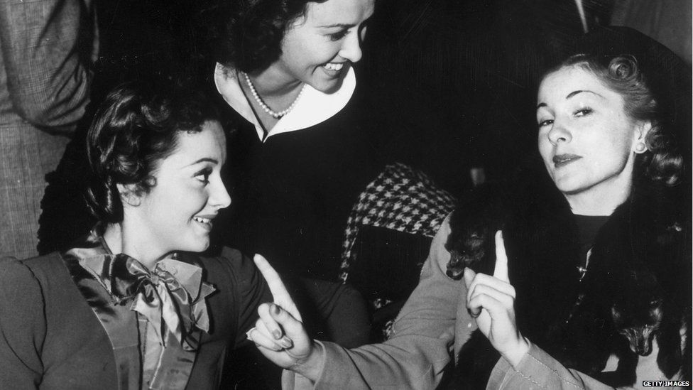 Olivia De Havilland and Joan Fontaine with actress Margaret Lindsay (centre)