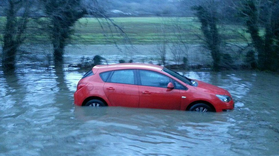 Car stuck in flood