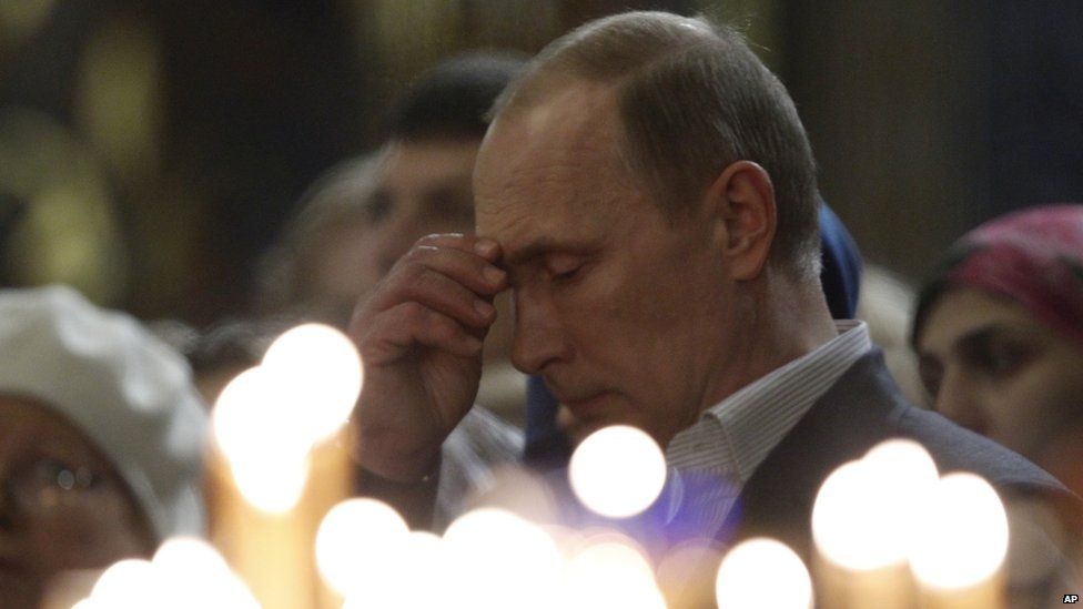 Vladimir Putin praying, January 6, 2014