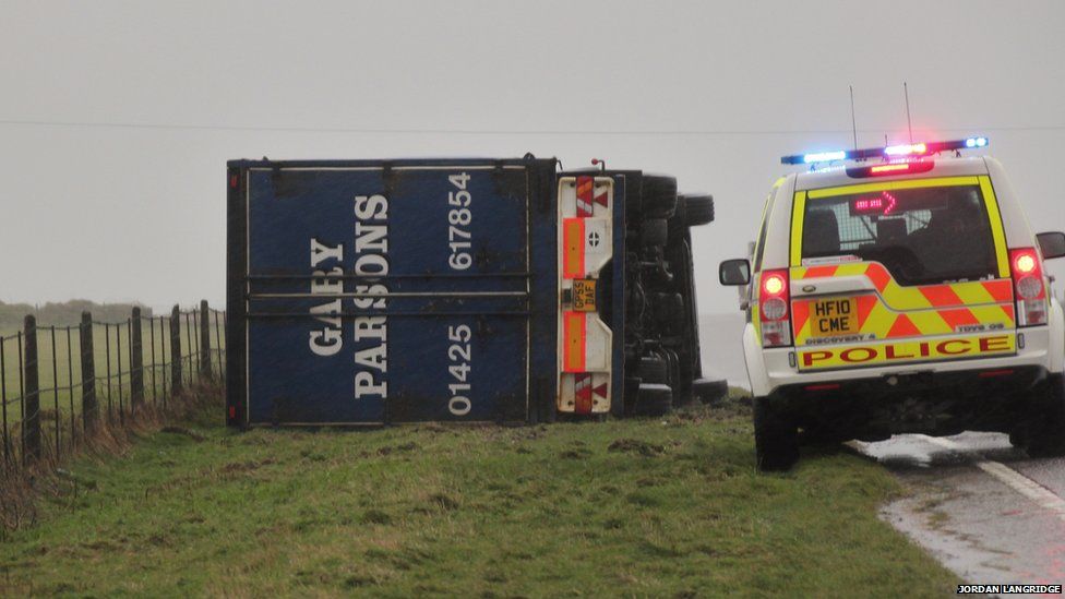 Overturned lorry on the A35 between Bridport and Dorchester.
