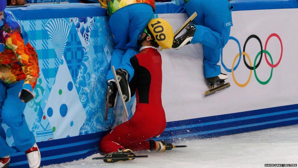 China's Kexin Fan crashes out into the barrier during the women's 500m short track speed skating semi final at the Sochi Winter Olympics