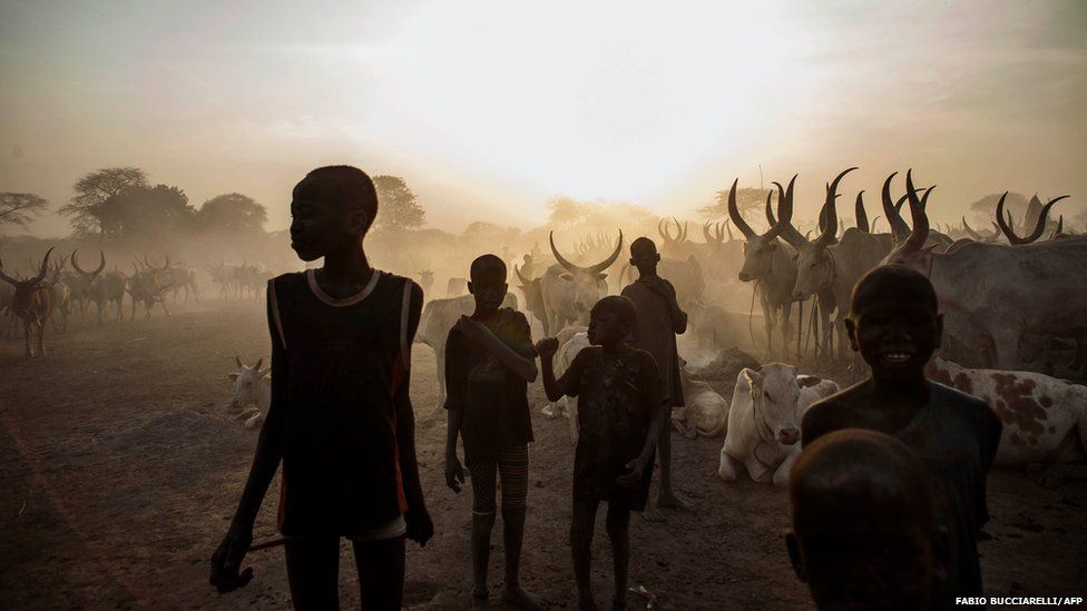 South Sudanese children from the Dinka ethnic group pose at cattle camp in the town of Yirol, in central South Sudan
