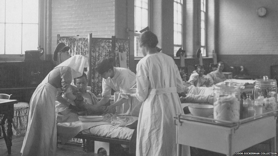 A nurse and two orderlies dressing patients’ wounds at Endell Street Military Hospital during World War One
