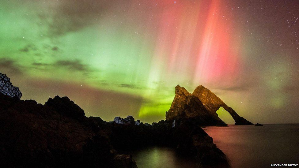 The Northern Lights seen at Bow Fiddle Rock in Portknockie, Moray.
