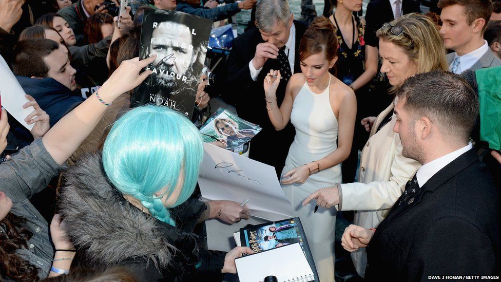 Actress Emma Watson signs autographs