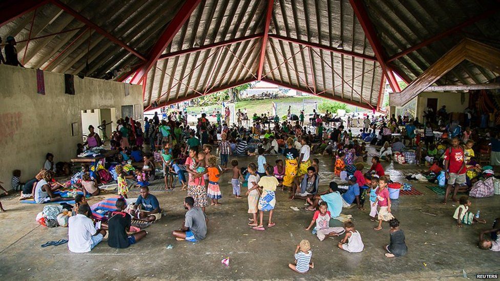 People can be seen at the Panatina Pavilion evacuation centre after severe flooding in the capital Honiara in the Solomon Islands in this picture released by World Vision on 6 April, 2014