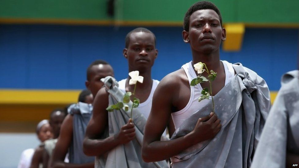 Performers enter Amahoro Stadium in Kigali, Rwanda, during the commemoration of the 20th anniversary of the 1994 genocide (7 April 2014)