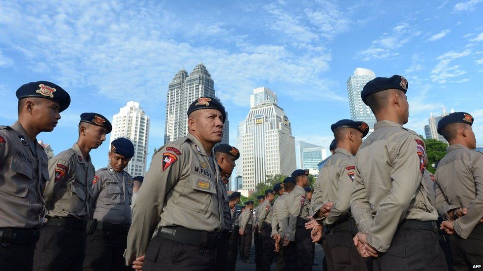 Indonesian policemen attend a roll call for upcoming legislative elections at the Jakarta police headquarters in Jakarta on 7 April, 2014