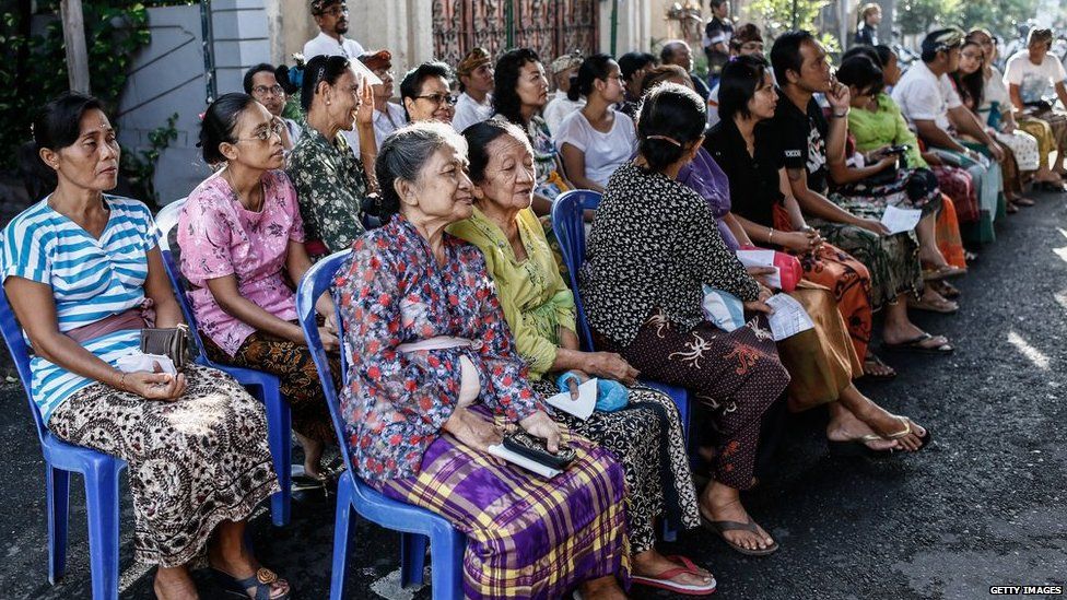 Voters wait at a polling station during legislative elections on 9 April, 2014 in Denpasar, Bali, Indonesia