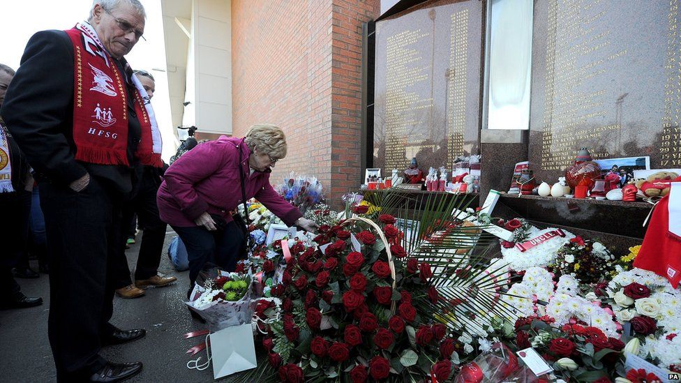 Flowers are laid outside Anfield before the memorial service to remember the 96 people who died at Hillsborough.