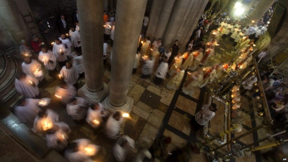 Christian clergymen in the Church of the Holy Sepulchre in Jerusalem on 20 April 2014