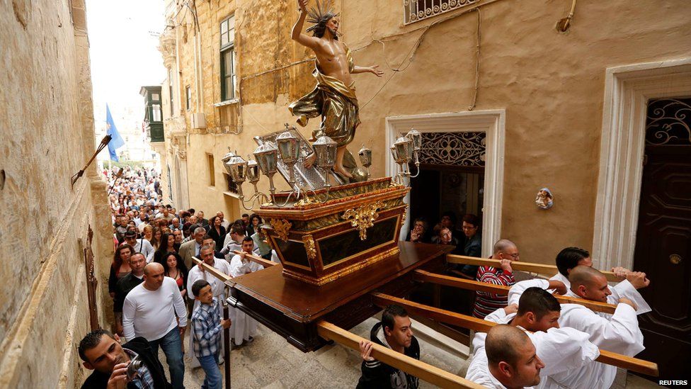 Worshippers carry a statue of Christ through the streets of Cospicua, outside Valleta in Malta on 20 April 2014