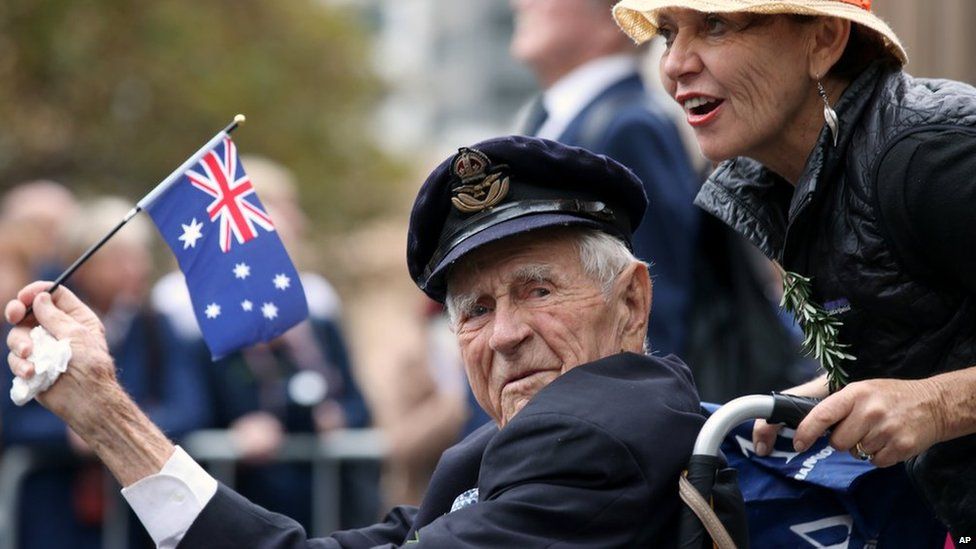 A veteran is pushed in a wheelchair during the ANZAC Day parade, in Sydney, on Friday, 25 April, 2014