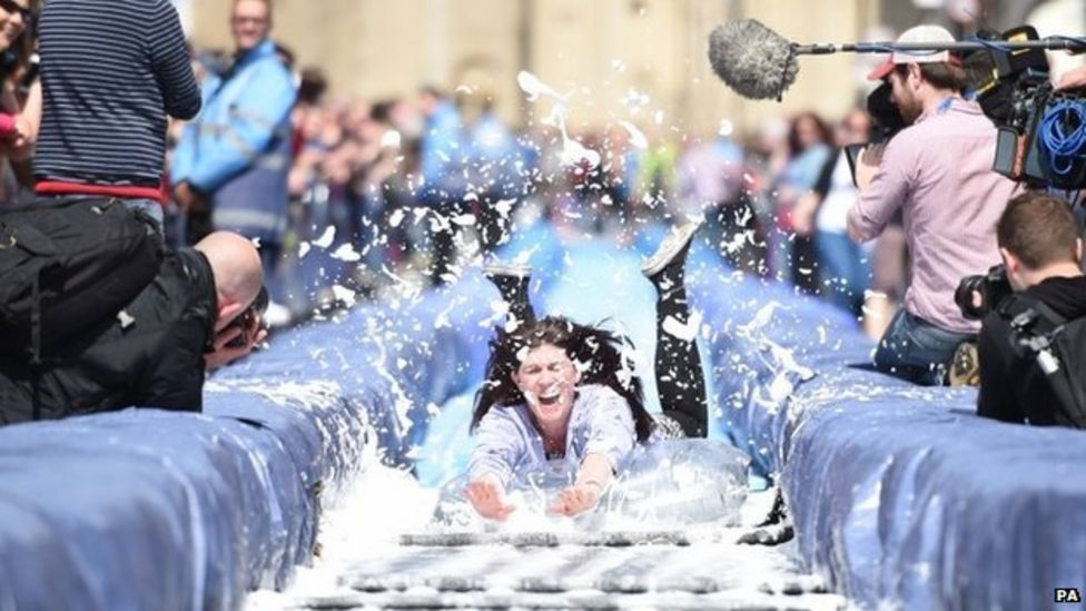 Bristol giant water slide sees thrillseekers soaked BBC News