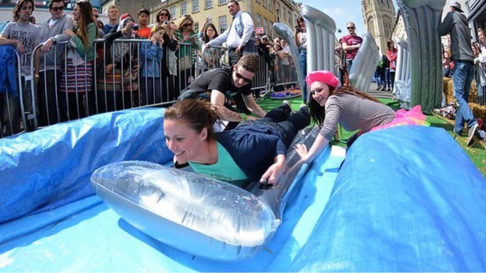 Bristol giant water slide sees thrillseekers soaked BBC News