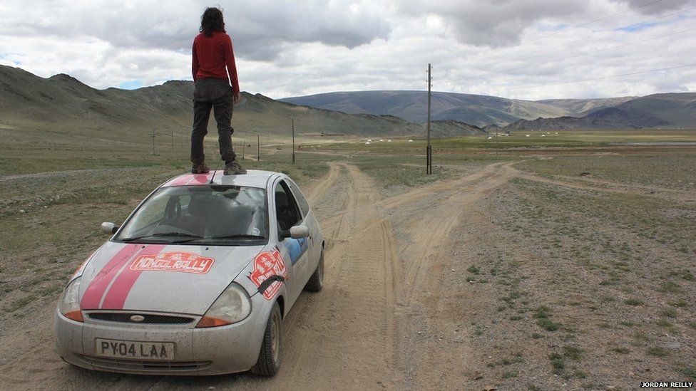 Woman standing on Ford Ka
