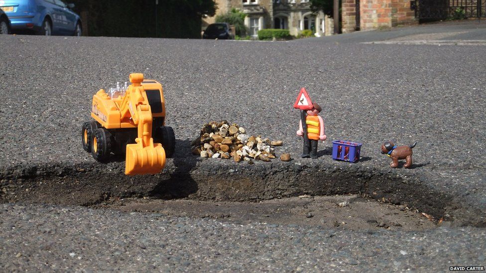 Toys and a pothole