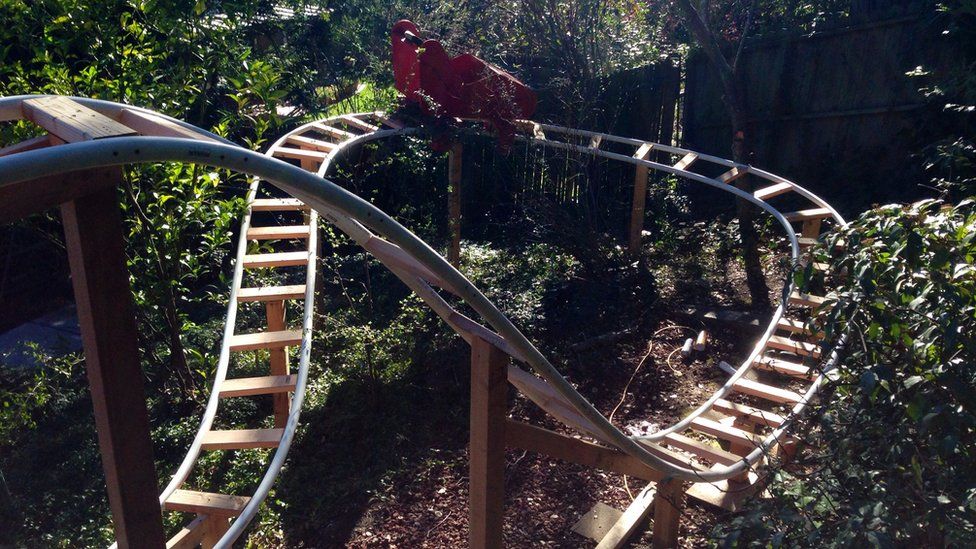 Boy helps his dad build rollercoaster in back garden BBC Newsround