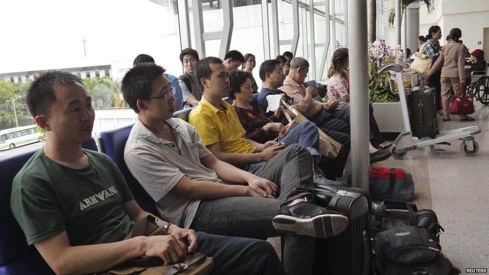Chinese nationals wait for departure at Tan Son Nhat airport in Ho Chi Minh City on 15 May, 2014