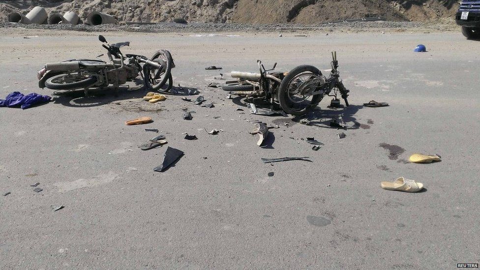 Damaged motorcycles are seen on the road near a Formosa steel mill in Ha Tinh province on 15 May, 2014