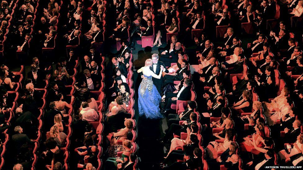 French actor and Master of Ceremony Lambert Wilson and Australian actress Nicole Kidman dance during the Opening Ceremony of the 67th edition of the Cannes Film Festival, southern France