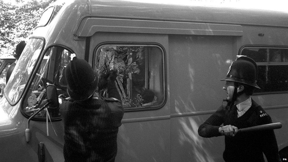 Police smash vehicle windows as a 'peace convoy' of some 140 vehicles tried to get past police in an attempt to hold a banned festival at Stonehenge in 1985