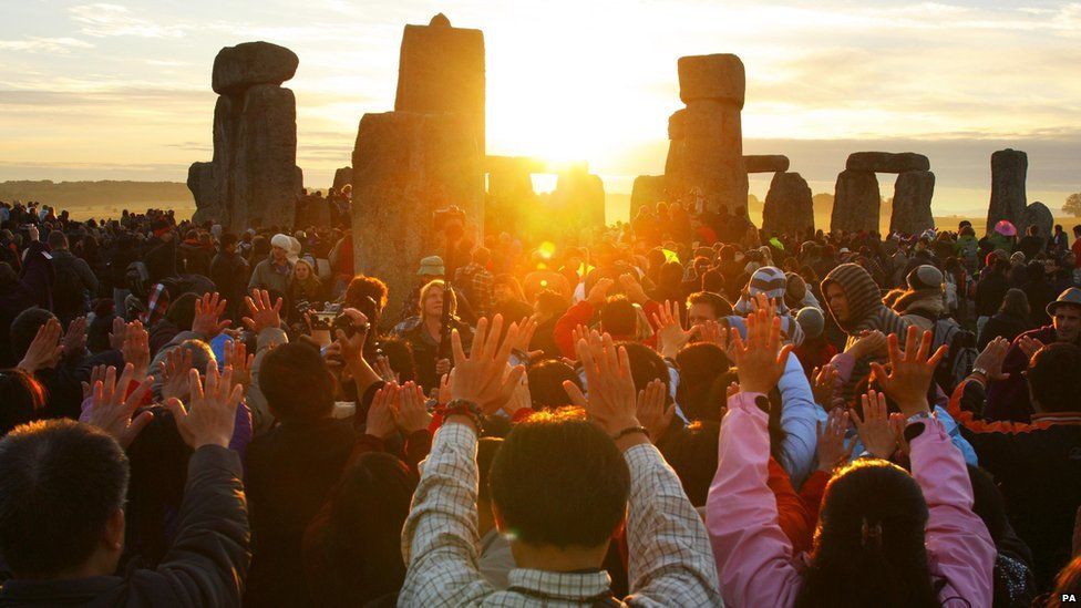 Revellers gather at the World Heritage site at Stonehenge in Wiltshire in 2010 to watch the sunrise during the summer solstice, marking the longest day of the year.