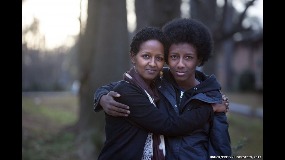 Naima, 36, with her son Teso, 14, outside their home in Atlanta, Georgia.