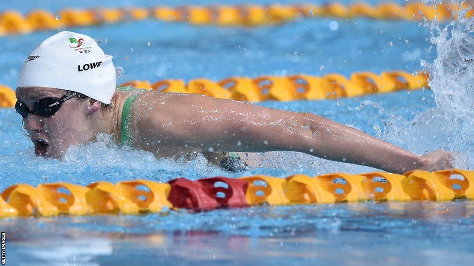 Jemma Lowe competes in the women’s 100m butterfly on the first day of the Commonwealth Games.