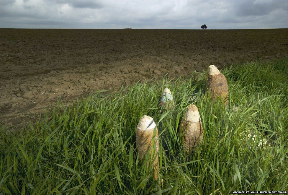 Unexploded shells uncovered by ploughing near Munich Trench Cemetery