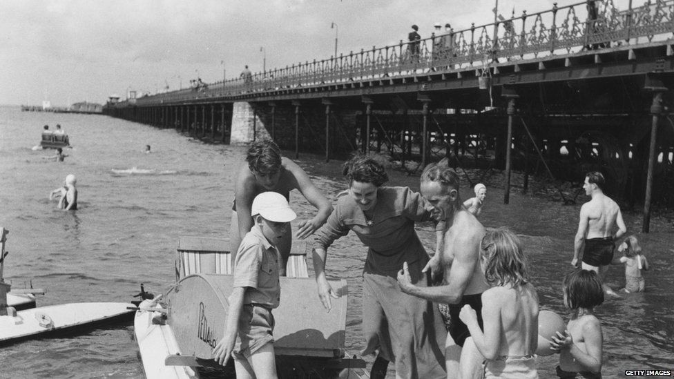 August 1950: Queues forming for the pedalos at the seaside in Ryde, Isle Of Wight