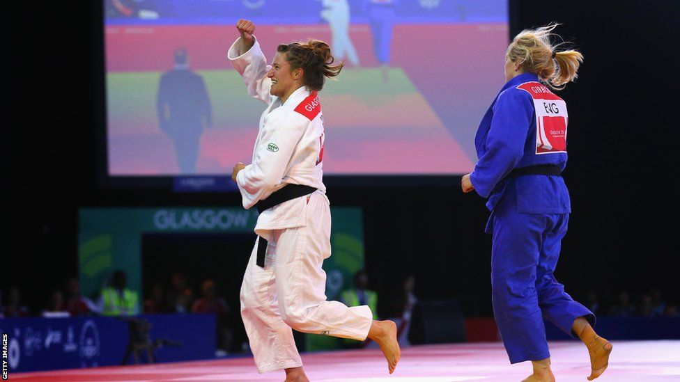 Judoka Natalie Powell celebrates after defeating England's Gemma Gibbons to secure Wales' second gold at the Commonwealth Games.