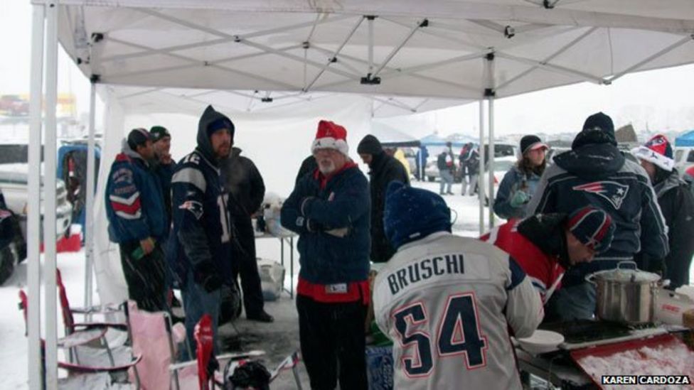 Fans celebrating at a tailgate party