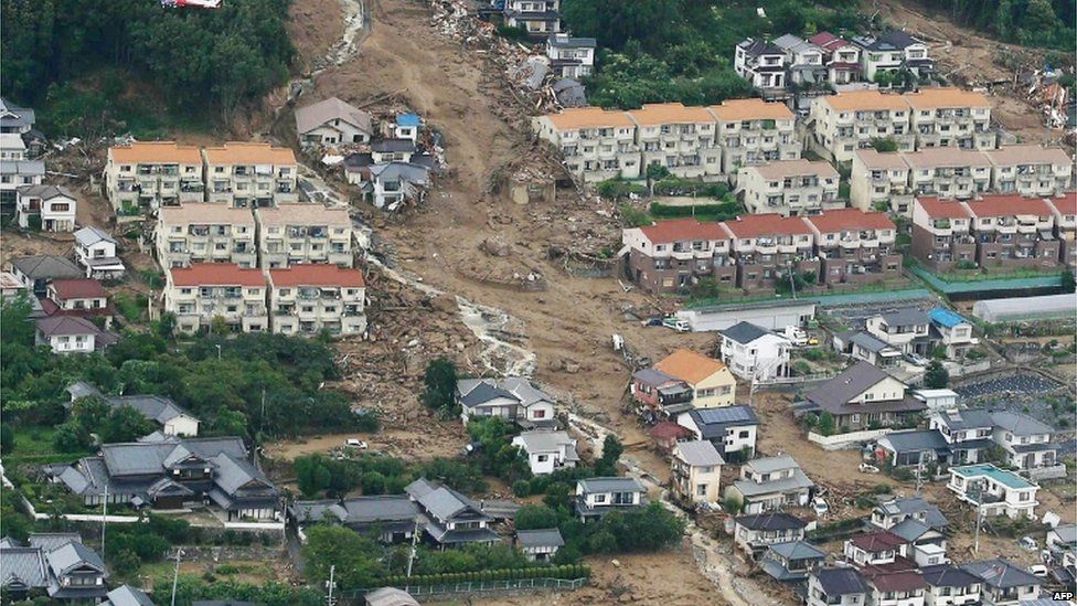 This aerial view shows the damage caused by a landslide after heavy rains hit the city of Hiroshima, western Japan, on 20 August, 2014