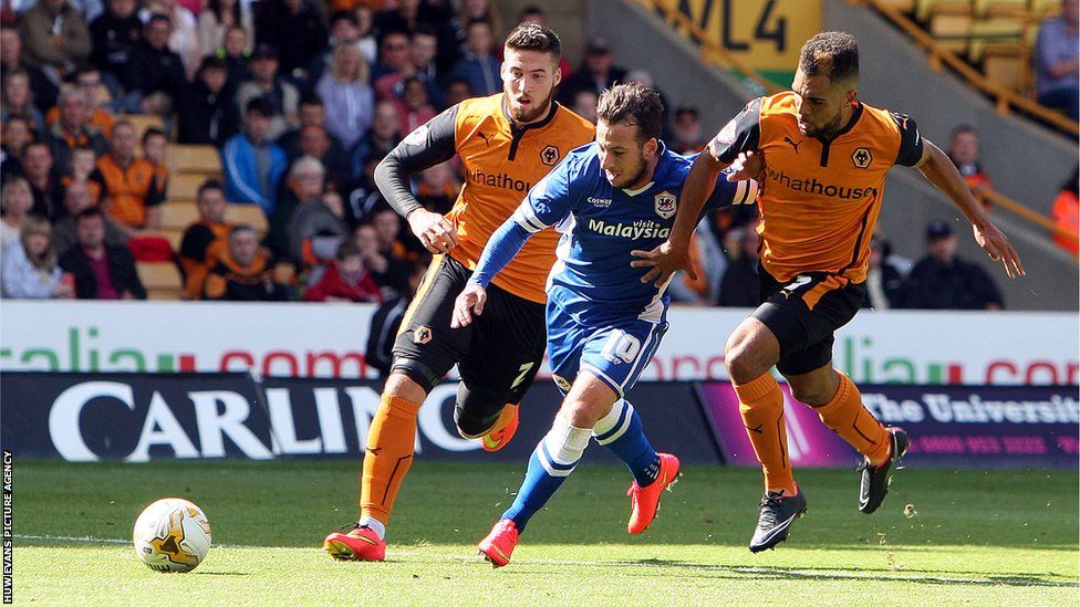 Cardiff City's Adam Le Fondre battles his way through the Wolves defence at Molineux.