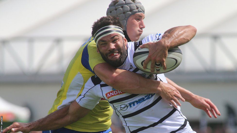 Jonathan Davies makes his Clermont Auvergne Top 14 debut in their win at Brive and is seen here tackling Arnaud Mignardi