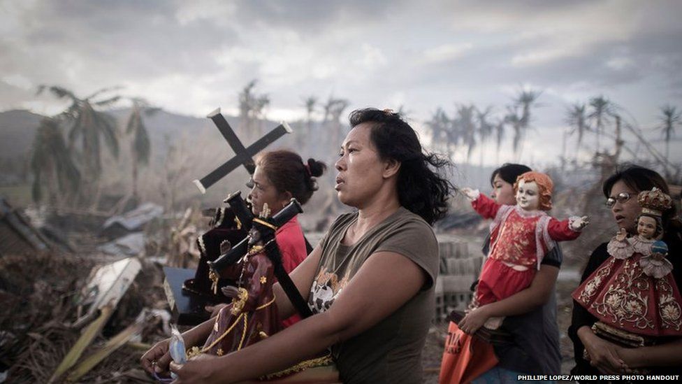 Survivors of typhoon Haiyan marching during a religious procession in Tolosa, Philippines