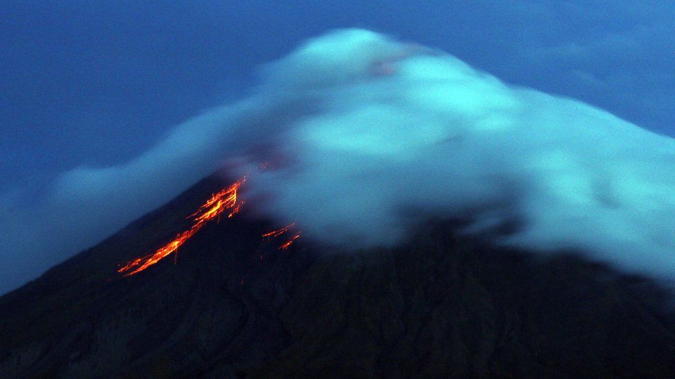 Lava flows from the crater of Mayon volcano seen from Legazpi City, Albay province, southeast of Manila on 17 September, 2014