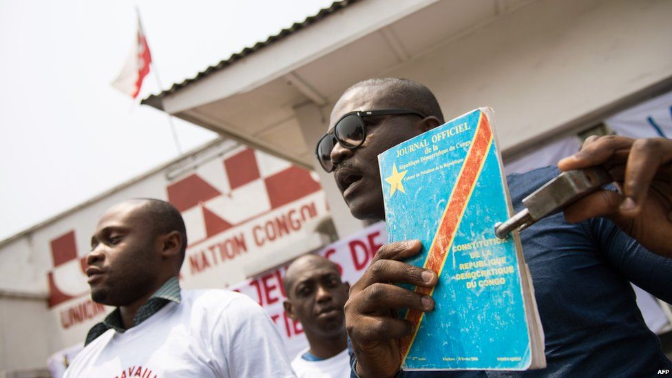 A protester with the constitution in front of the UNC opposition party's headquarters in Barumbu, DR Congo - Saturday 13 September 2014