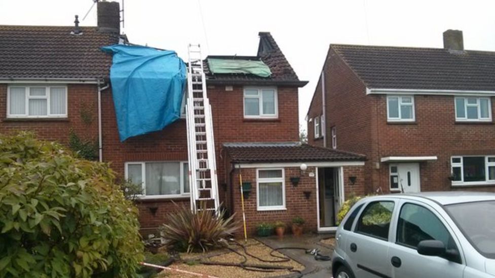 Train stuck in flood water after storms in southern England BBC News