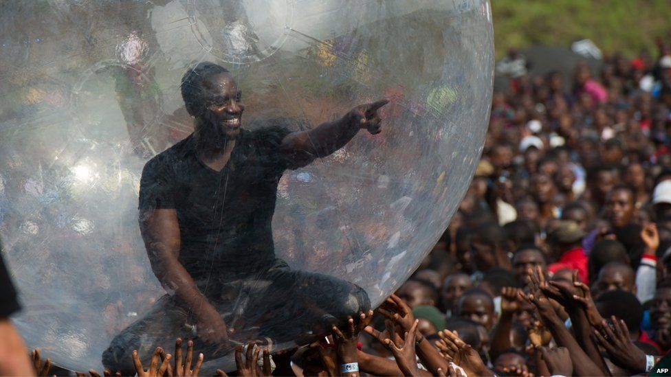 American-Senegalese hip-hop star Akon performs at a concert as part of "Peace One Day" celebrations on International Peace Day at the airport in Goma in the east of the Democratic Republic of the Congo on 21 September 2014