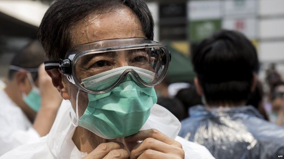 Pro-democracy activist and former legislator Martin Lee, wearing goggles and a mask to protect against pepper spray, attends a demonstration near the government headquarters in Hong Kong on 28 September, 2014