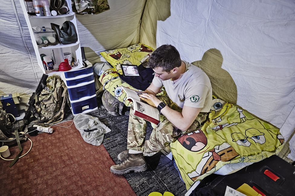 Soldier sitting on bed