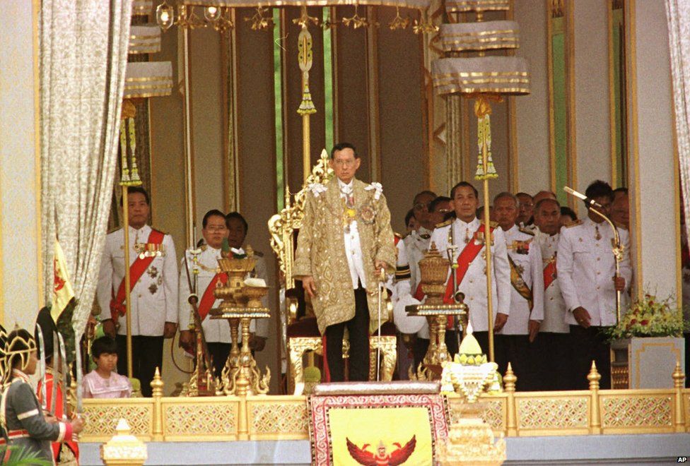 King Bhumibol Adulyadej prepares to deliver a royal speech at the Golden Jubilee Pavilion at Sanam Luang field in Bangkok, 1996