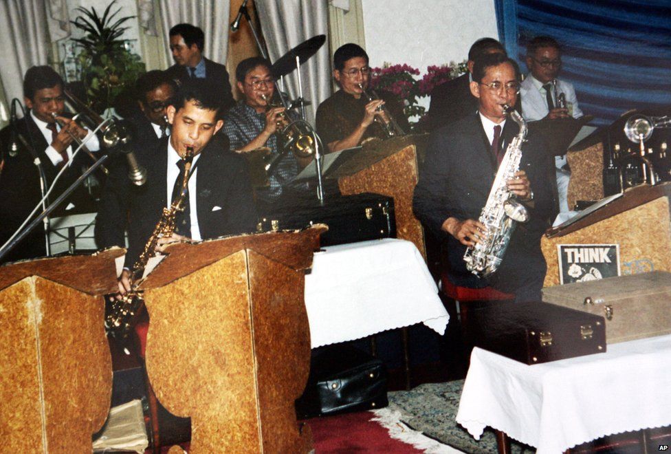 King Bhumibol Adulyadej (right) plays with his son, Crown Prince Vajiralongkorn (left) and other Thai musicians.