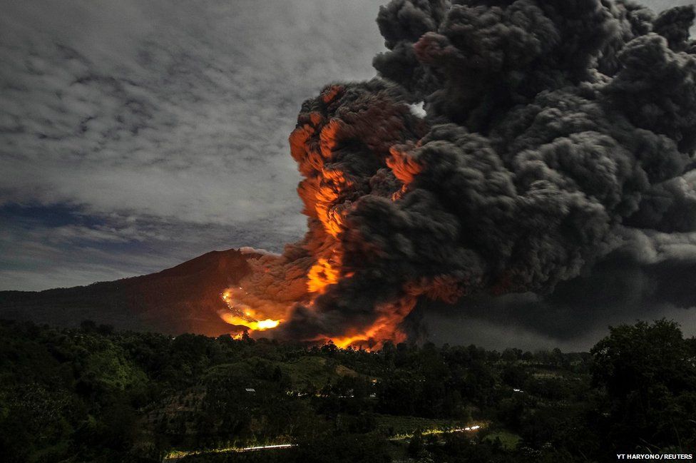 Mount Sinabung erupts, as seen from Tiga Pancur village, Karo Regency in Indonesia's North Sumatra