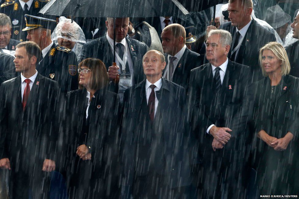 Russian President Vladimir Putin and Serbian President Tomislav Nikolic attend a military parade in Belgrade